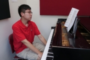 031 Eric Lin studying the score
